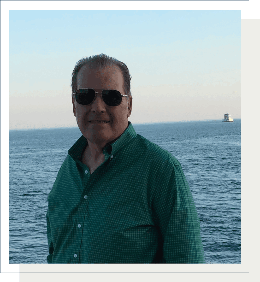 Person in green shirt near water